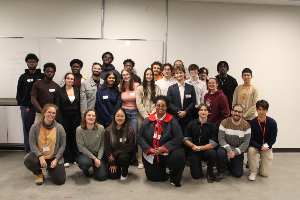 A large group of students posing together at the event